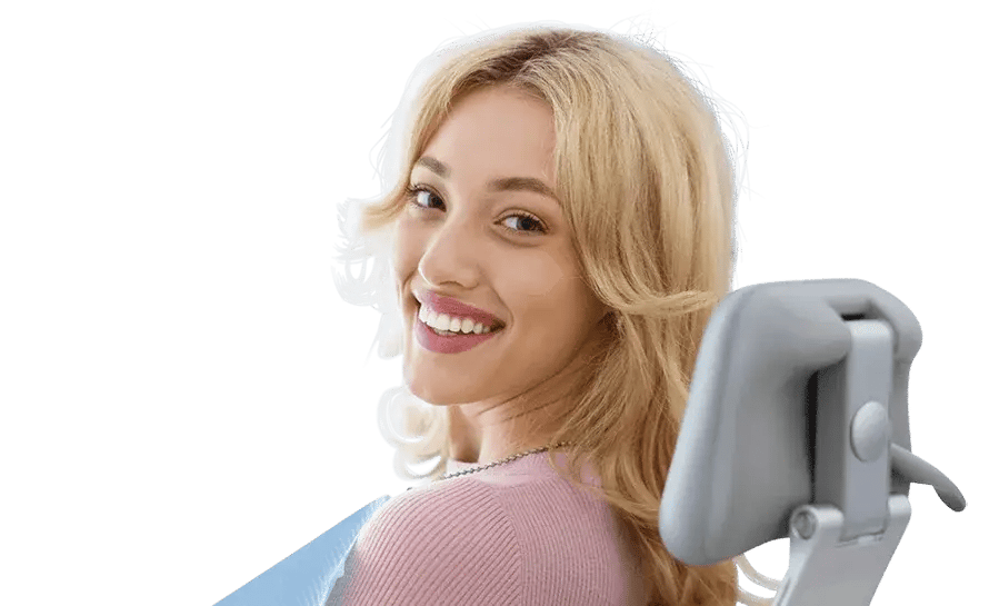 smiling-young-woman-at-dental-exam-890x545
