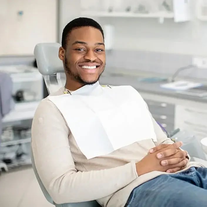 young-man-at-dental-exam-705x705
